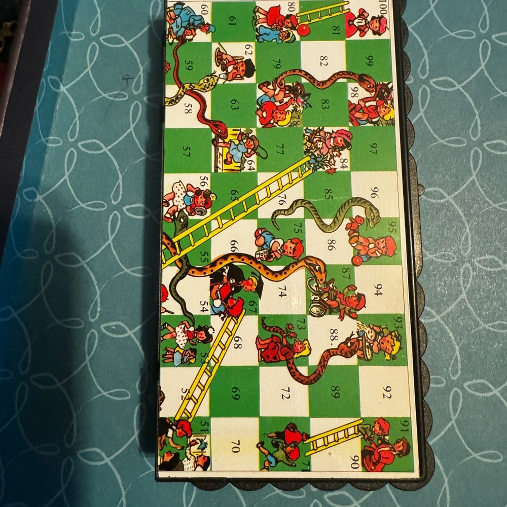 Vintage travel size magnetic snake and ladder game